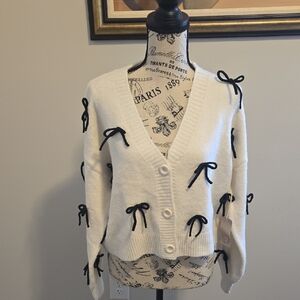 Chic Women's White Cardigan with Black Bow Accents